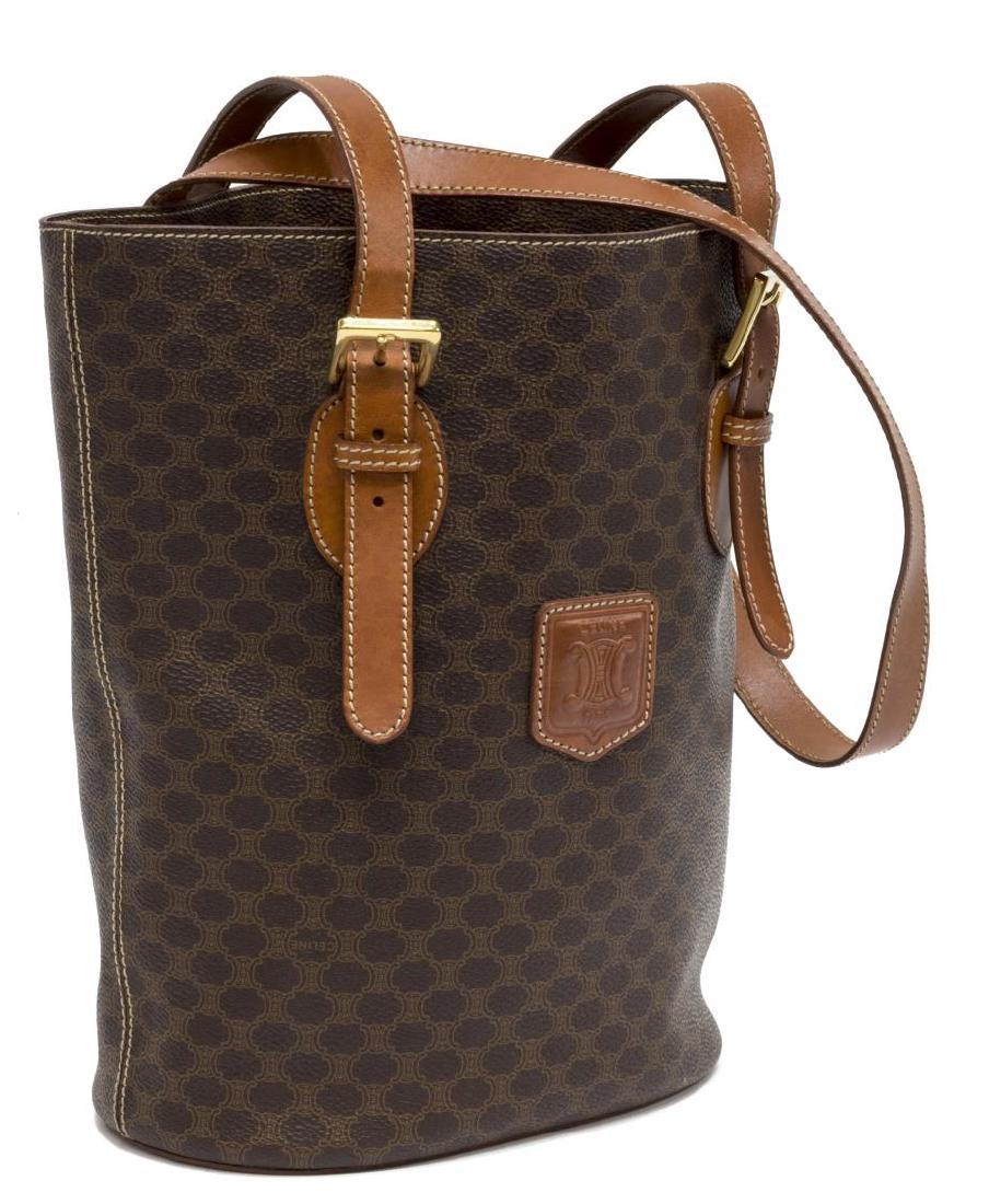 CELINE BROWN MACADAM CANVAS TOTE/ SHOULDER BAG: Celine tote/ shoulder bag, in brown"Macadam" coated canvas, with brass hardware, brown leather trim, dual adjustable flat top handles over open top, lined segmented interior centered by zipper pocket,