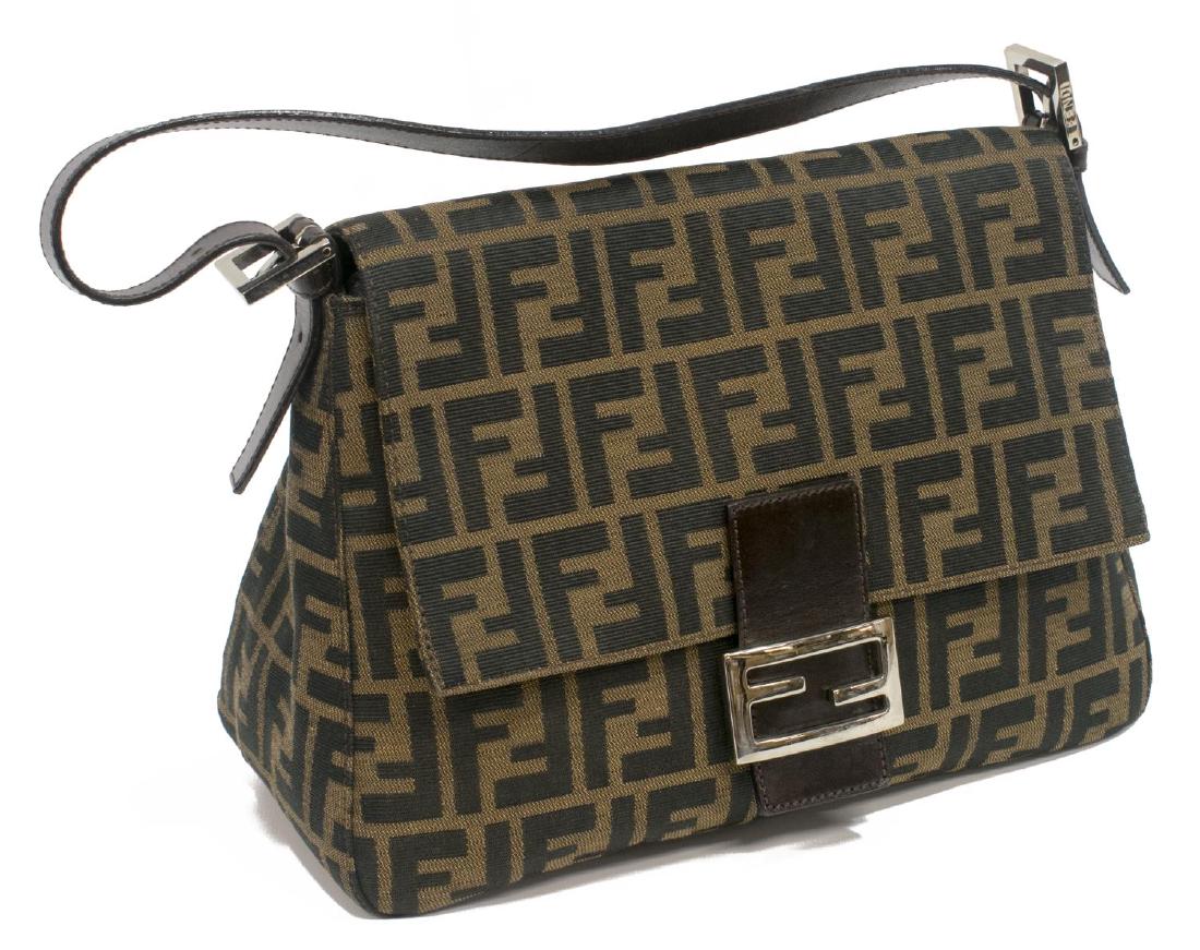 FENDI ZUCCA MONOGRAM CANVAS SHOULDER BAG: Fendi shoulder bag in brown Zucca monogrammed canvas, brown leather accents, silver tone hardware, magnetic snap opening flap to dark brown lined interior with single zip side pocket, adjustable shoul