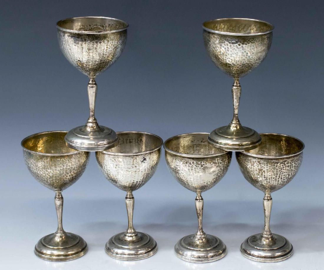 (6) COLOMBIAN HAMMERED COIN SILVER WINE GOBLETS: (lot of 6) Coin silver wine goblets, likely Colombia, with hammered bowl and tapered stem, hallmarked AM in cartouche underfoot, approx 4.25"h, 2.5"diam, 12.76 ozt total (weighable silver only) Start 