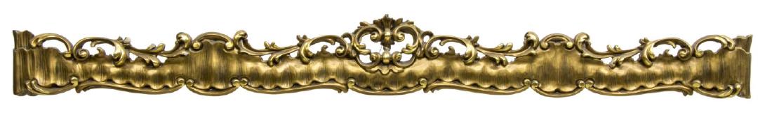 ITALIAN CARVED GILTWOOD CURTAIN VALENCE OR PELMET: Giltwood architectural curtain valence or pelmet, Italy, having pierced and carved rail, surmounted by scrolled foliate crown, some gilt wear, approx 7.75"h, 67.25"w, 8.5"d Start Price: $100.00