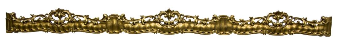 ITALIAN CARVED GILTWOOD CURTAIN VALENCE OR PELMET: Giltwood architectural curtain valence or pelmet, Italy, having pierced and carved rail, surmounted by scrolled foliate crown, some gilt wear, approx 7.75"h, 95"w, 8.75"d Start Price: $100.00