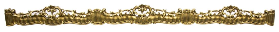 ITALIAN CARVED GILTWOOD CURTAIN VALENCE OR PELMET: Giltwood architectural curtain valence or pelmet, Italy, having pierced and carved rail, surmounted by scrolled foliate crown, some gilt wear, approx 7.75"h, 97.5"w, 13"d Start Price: $100.00