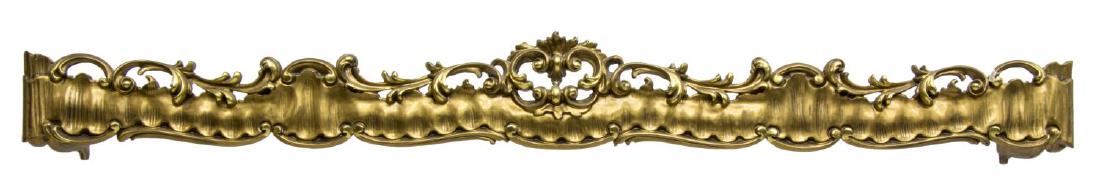 ITALIAN CARVED GILTWOOD CURTAIN VALENCE OR PELMET: Giltwood architectural curtain valence or pelmet, Italy, having pierced and carved rail, surmounted by scrolled foliate crown, cracking and loss to gilt, approx 7.75"h, 68.25"w, 12.5"d Start Price: $1