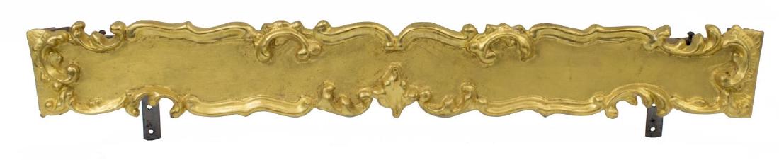 CONTINENTAL GILTWOOD CURTAIN VALENCE OR PELMET: Giltwood curtain valence or pelmet, Continental, carved scroll design, with curtain track attached, minor loss to gilt, approx 5.5"h, 28.75"w, 3.25"d Start Price: $80.00