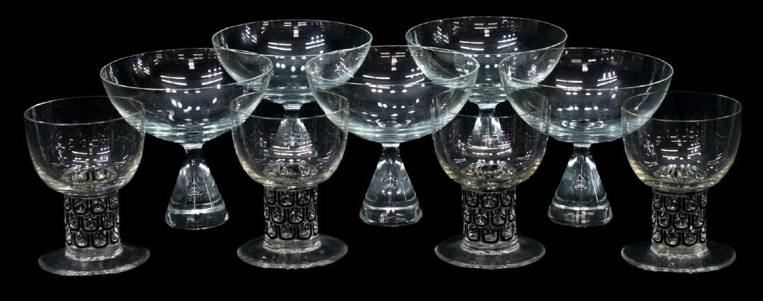 (9) RENE LALIQUE & HOLMEGAARD ART CYSTAL STEMWARE: (lot of 9) Stemware group: (4) Rene Lalique colorless goblets, wide cylindrical stem accented in black, one with chip to pedestal foot, signed R. Lalique France underfoot, 3.55"h; (5) Danish Holmegaar