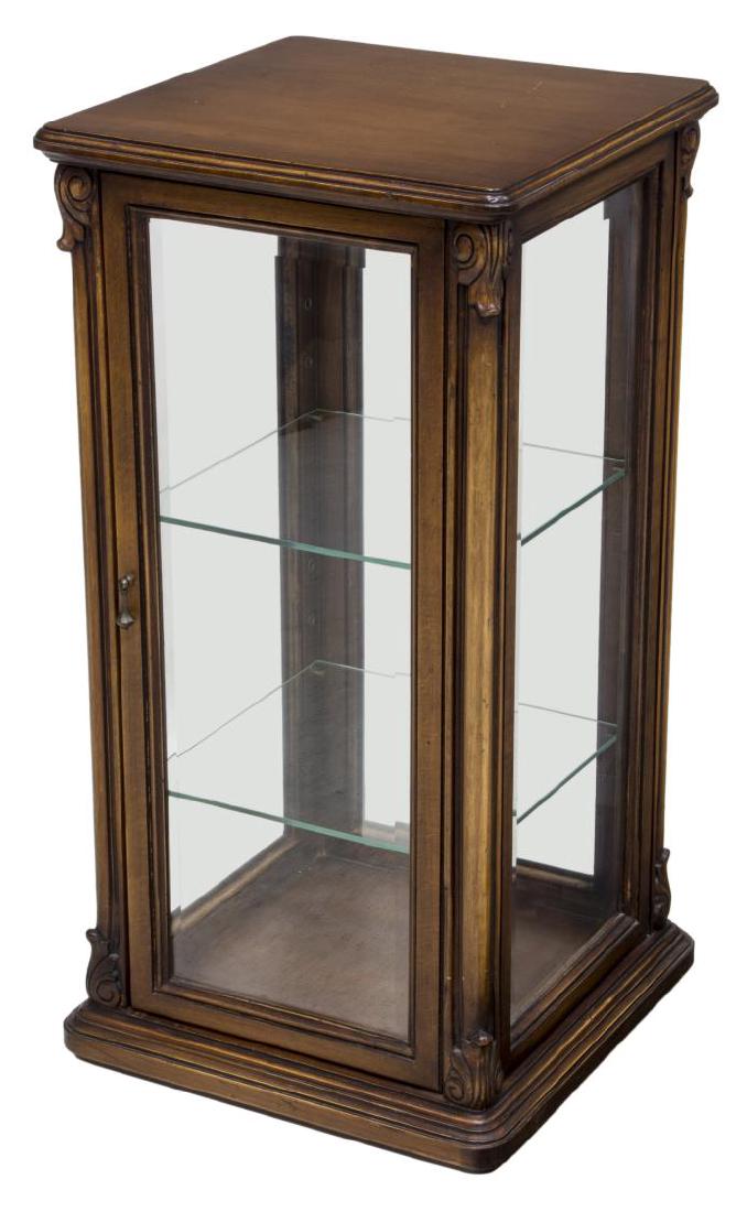 ITALIAN MAHOGANY FINISH BEVELED GLASS VITRINE: Italian mahogany finish vitrine, 20th c., square top, over scroll accented body, four beveled glass sides, door to front, with metal tear drop pull, on caster feet, approx 30.5"h, 15.25"w, 15.25"d Sta