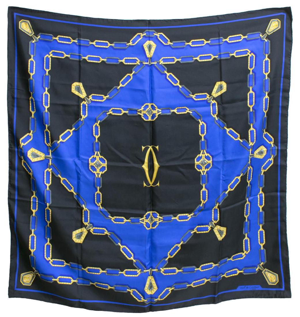 MUST DE CARTIER SILK TWILL SCARF: Must de Cartier silk twill scarf, with chain-link logo print throughout, in black, navy, and gold, lacking care tag, approx 33"h, 33"w, 0.25lbs *Provenance: Luxury goods are offered in partnership wit