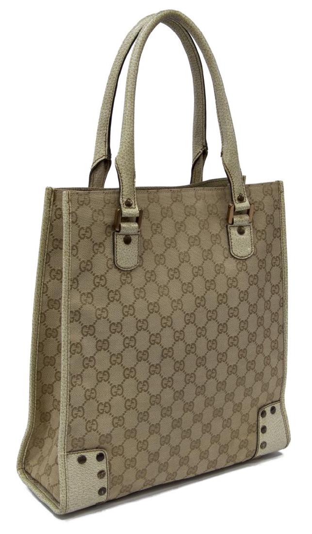 GUCCI GG CANVAS TALL TOTE BAG: Gucci tall tote bag, in tan GG canvas, with copper-tone hardware, tonal leather trim, dual rolled top handles, dual pockets at interior walls; one with zip closure, open top, some spotting to leather,