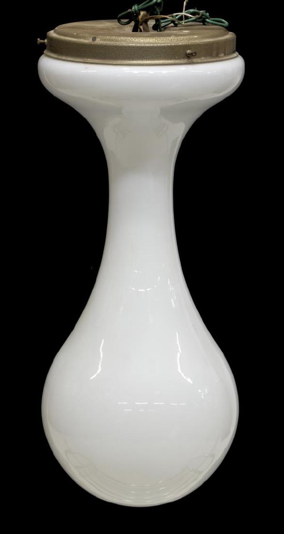 MID-CENTURY MODERN BIOMORPHIC HANGING LIGHT: Mid-century modern hanging light, c. 1970, in the style of Peill & Putzler, with metal cap and biomorphic white glass shade, in need of wiring, approx 24"h, 10.25"diam Start Price: $150.00