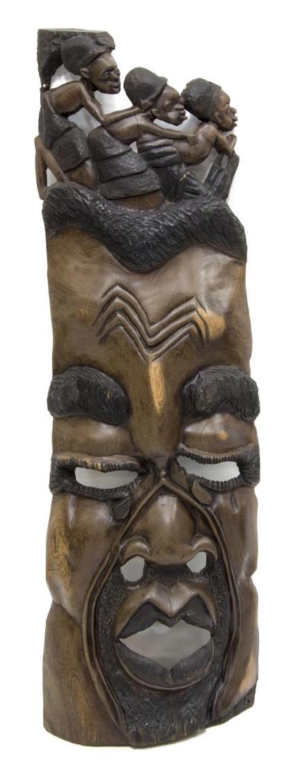 CARVED WOOD HAITIAN TRIBAL MASK WITH FIGURES: Carved wood tribal mask, Haiti, 20th c., with figures, glue restoration visible at back, approx 48.5"h, 15"w, 22lbs Start Price: $50.00