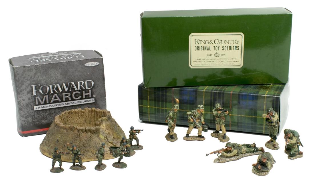 (14) U.S. & GERMAN WWII METAL MINIATURE FIGURES: (14) WWII miniature metal figures and infrastructure: (4) U.S. WWII infantry soldiers, "D Day '44", by King & Country, 2.5"h,appear as new in original box; (3) German WWII infantry by King & Country,