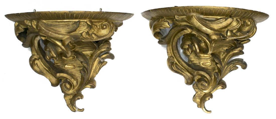 (2) ITALIAN LOUIS XV STYLE GILDED WALL BRACKETS: (pair) Large Louis XV style wood and plaster wall brackets, scrolled rocaille carving, restorations with age, approx 13"l, 13.25"w, 7.5"d, 10lbs Start Price: $100.00