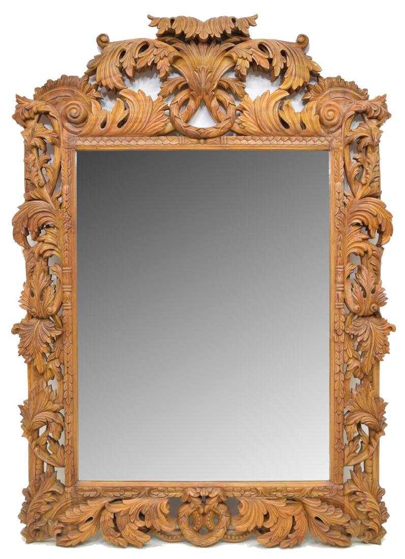 LARGE HEAVILY CARVED BEECH WOOD WALL MIRROR 83"H: Large beech wood framed wall mirror, heavily pierced and carved frame with scroll and foliate design, with laurel wreath accents to top and bottom, holding flat plate mirror to center, approx 83.75"h,