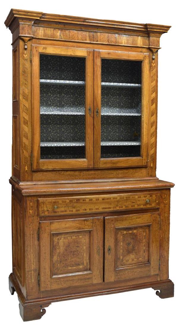 TUSCAN WALNUT MARQUETRY CUPBOARD, 19TH C.: Tuscan walnut cupboard/bookcase, 19th c., line and floral contrasting marquetry, having corniced top with carved drop tassel accents, over two door cabinet, glass fronts, shelves to interior, narrow w
