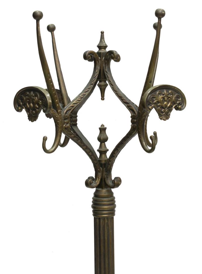 BRONZE HALL TREE WITH COAT & HAT RACKS: Bronze standing hall tree, having scroll form top issuing four arms ending in coat and hat hooks, spins on ball bearings around vasiform finial, fluted standard, rising on four foliate spider legs, wi