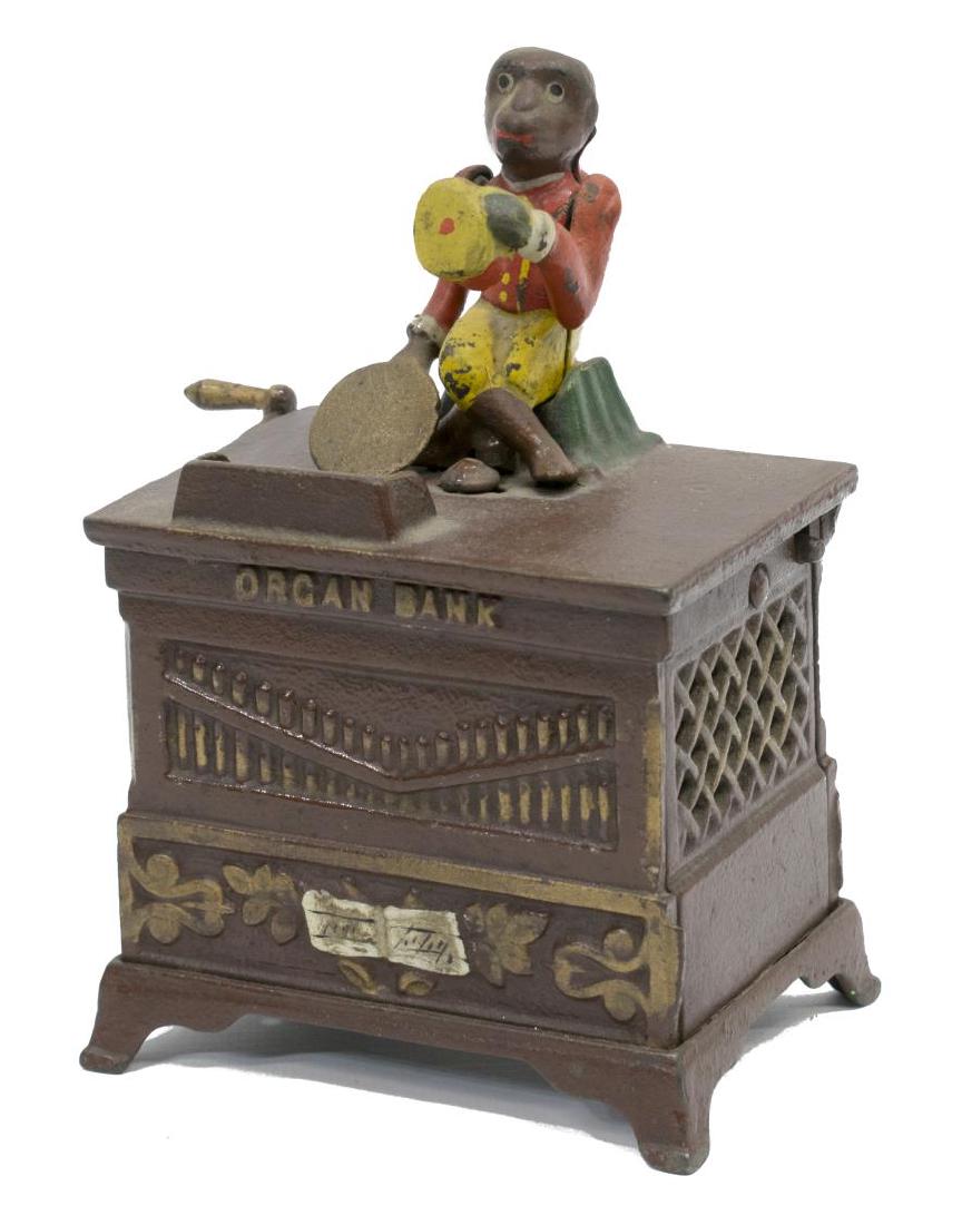KYSER & REX MONKEY ORGAN BANK, PAT. 1881, OPERATES: Cast iron Monkey Organ Bank, by Kyser & Rex, Frankfort, Pennsylvania, monkey tips hat with left hand and deposits coin in tray with right hand when crank is turned and a bell is rung, Pat. May 31, 199