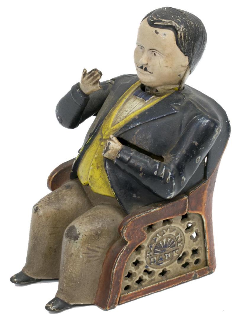 J&E STEVENS " TAMMANY" CAST IRON BANK, PAT. 1873: Cast iron "Tammany" or "The Little Fat Man" bank, J.& E. Stevens, design by John Hall, Massachusetts, depicting Boss Tweed, coin placed in his right hand drops into his coat pocket, nods his head, pat