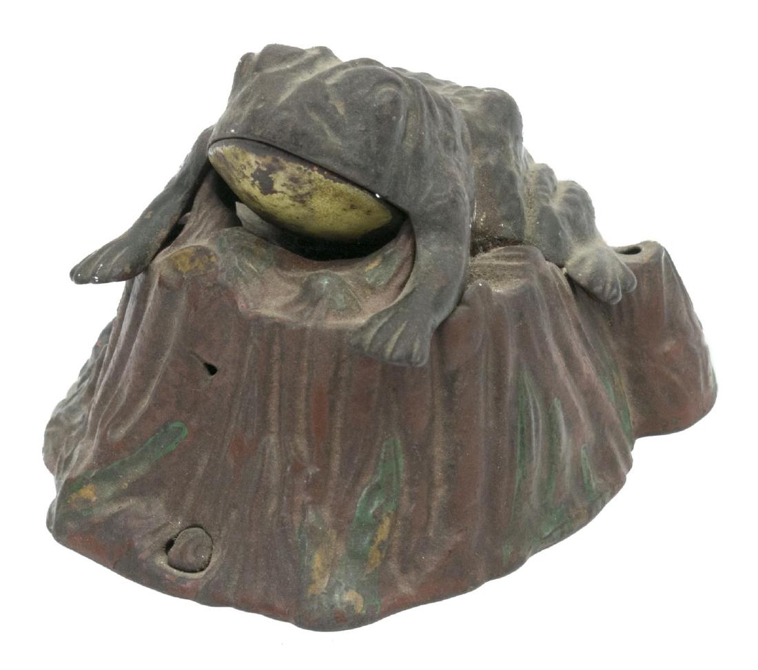 J. & E. STEVENS CAST IRON TOAD ON STUMP MECH. BANK: Cast iron bank "Toad on Stump", by J. & E. Stevens Co., Connecticut, small turtle at base of stump, toad opens his mouth for coin when lever is pressed, pat. Feb 2, 1875, operating, wear to original p
