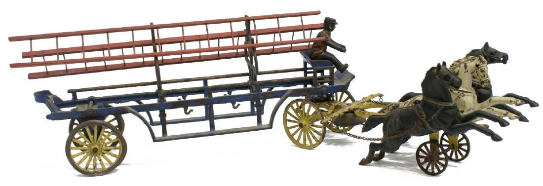LARGE CAST IRON THREE HORSE FIRE LADDER WAGON TOY: Cast iron three horse-drawn fire ladder wagon, c. 1910, possibly Dent Hardware Co. or Hubley Manufacturing Co., Pennsylvania, blue open body wagon and ladder supports with red ladders, yellow spoke wh