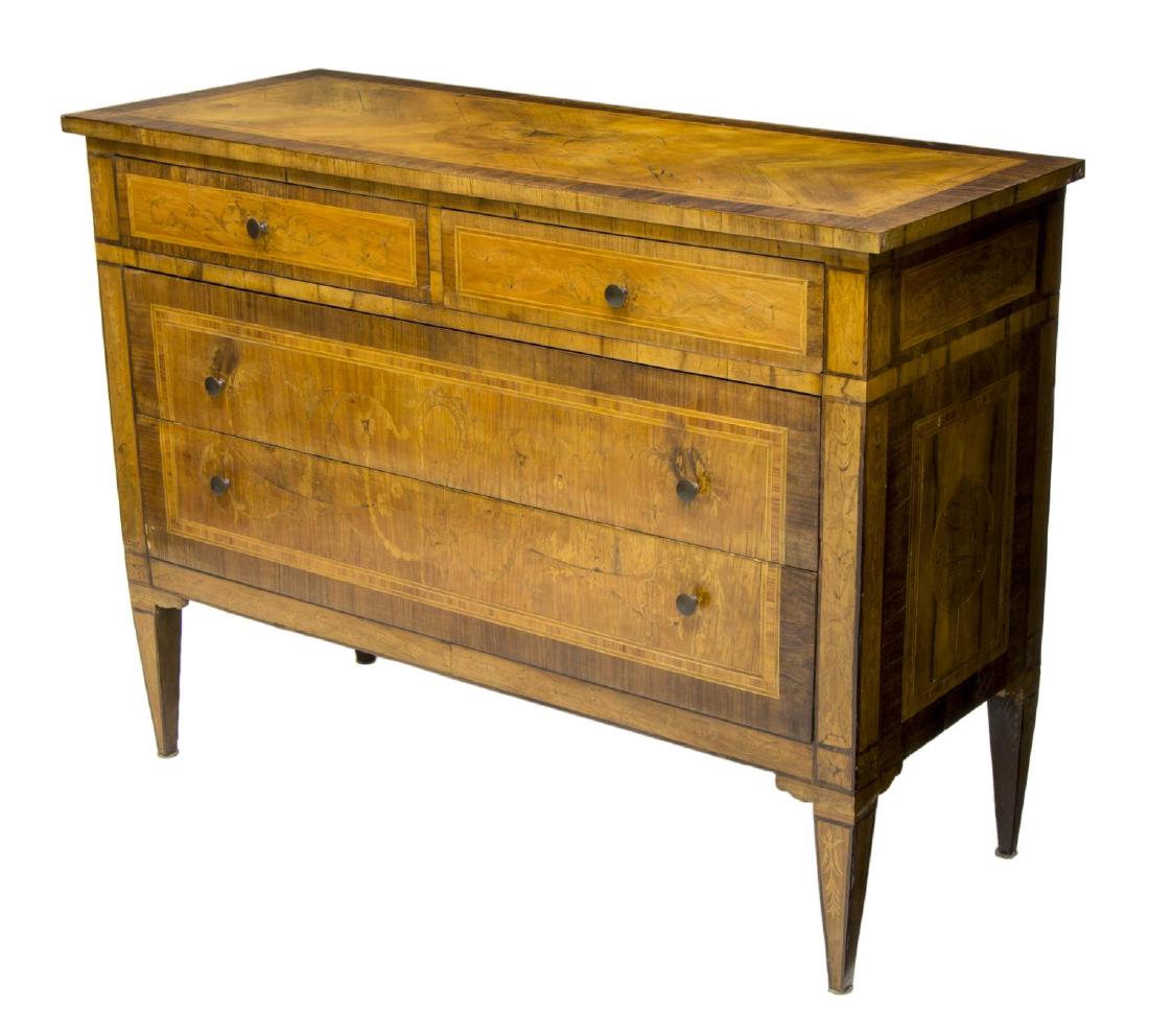 ITALIAN LOUIS XVI STYLE MARQUETRY COMMODE: Italian Louis XVI style commode, early 20th c., having substantial marquetry inlay, two short drawers above two long drawers, risign on squared tapered legs, 33.5"h, 45"w, 18"d Start Price: $400.00