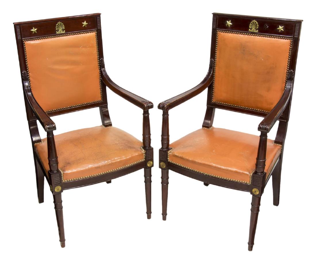 (2) FRENCH EMPIRE STYLE ROSEWOOD LEATHER ARMCHAIRS: (pair) French Empire style rosewood armchairs, corniced back, over gilt metal ormolu, featuring star and foliate designs, peach leather upholstery, with nail head accents, foliate carved arms, rising 