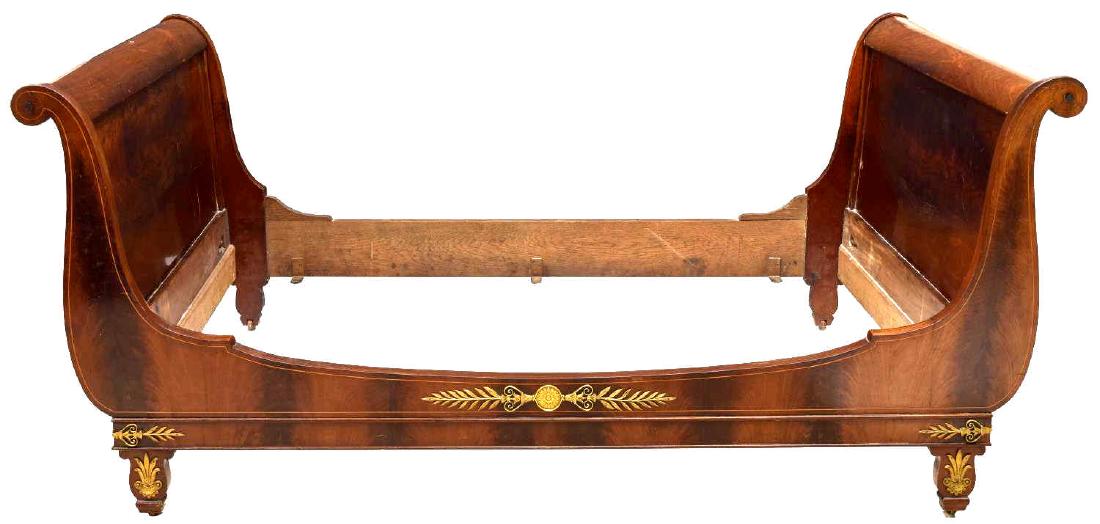 FRENCH EMPIRE STYLE MAHOGANY ALCOVE BED: French Empire style alcove bed, c. 1850, mahogany frame with rolled arms and gilt-metal foliate mounts, all rising on shaped legs, ending in casters, exterior: approx 40.25"h, 53.75"w, 85.75"d, interi