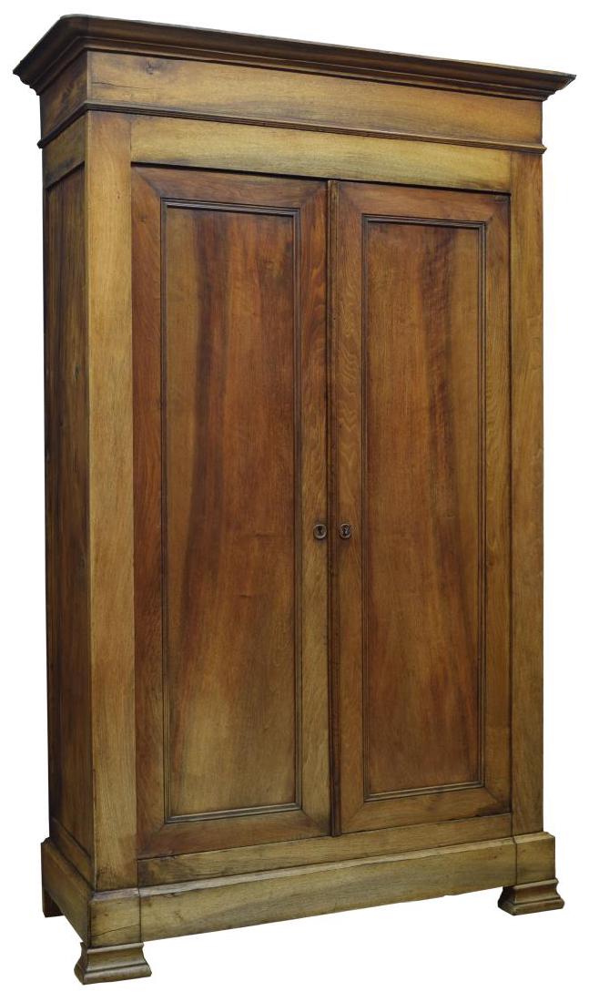 FRENCH LOUIS-PHILLIPE PERIOD WALNUT ARMOIRE: French Louis Philippe walnut armoire, c. 1850, rounded cornice over two door cabinet, having wooden escutcheons, shelves to interior, rising on bracket feet, approx 88.25"h, 54.5"w, 21.25"d Start Pric