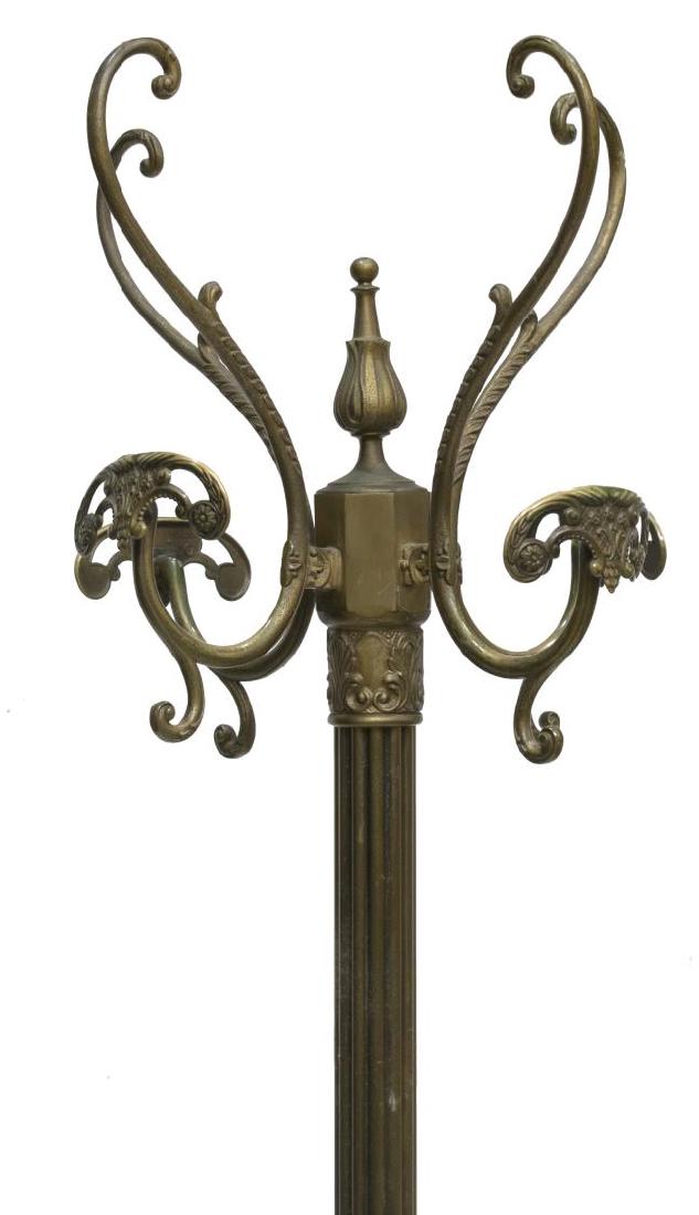 GILT BRASS HALL TREE WITH COAT & HAT RACK: Gilt brass standing hall tree, having vasiform finial, issuing four arms, ending in hat and coat hooks, fluted standard, having acanthus leaf accents, rising on tripartite base, approx 73.75"h, 19.75"