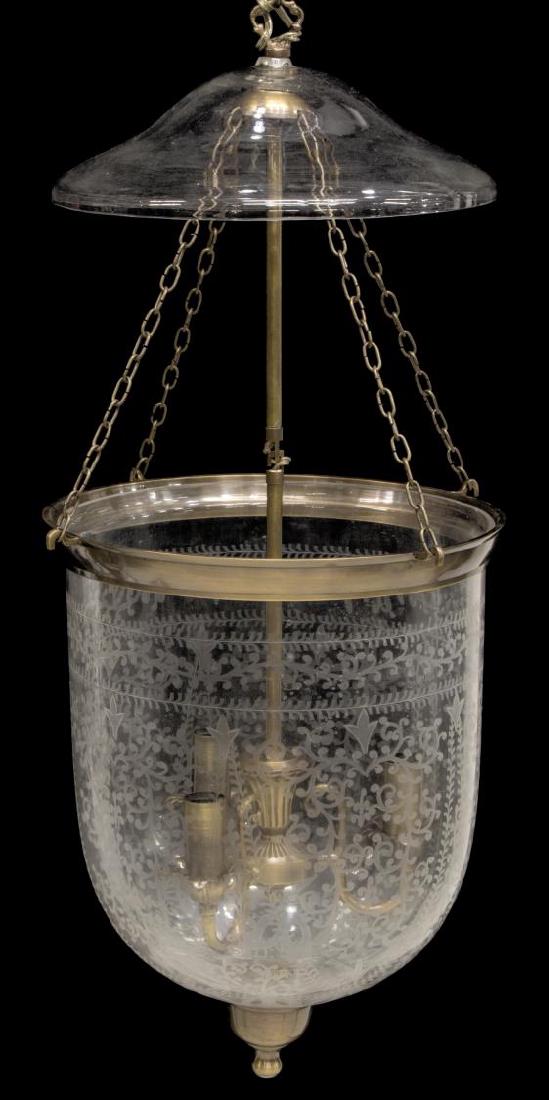 FOLIATE ETCHED THREE-LIGHT BELL JAR PENDANT LAMP: Foliate etched three-light hanging bell jar pendant lamp, a clear glass cover hung with support chain and long tubular standard, issuing three lights, enclosed in bell jar, approx 31"l, 12.5"diam (bel