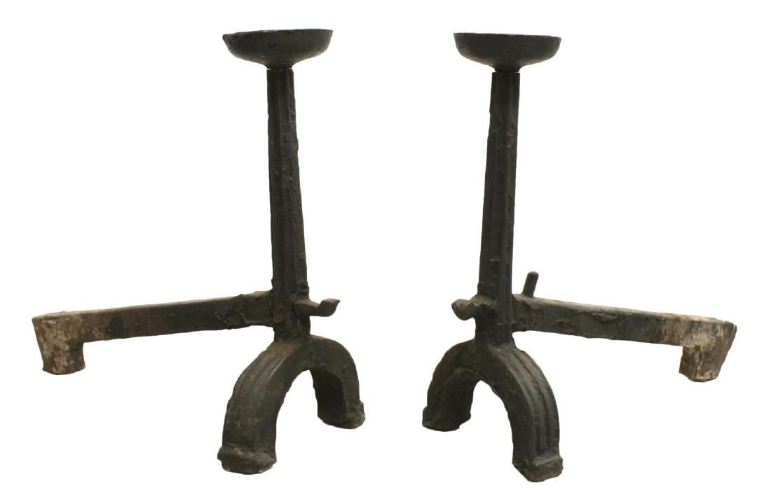 (2) FRENCH CAST IRON ANDIRONS, 18TH/19THC.: (pair) Cast iron andirons, French, 18th/19thc., having large candle cups to top, rising on fluted standard on trestle feet, descending cross bar, approx 26.25"h, 30.25"w, 11.5"d Start Price: 100.00