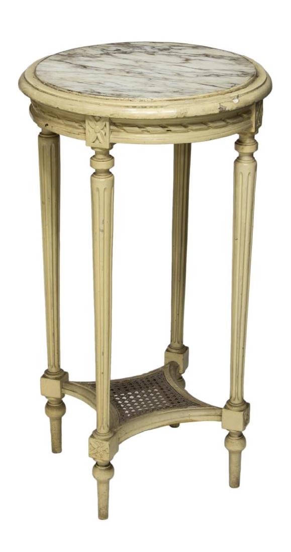 FRENCH LOUIS XVI STYLE MARBLE & CANE SIDE TABLE: French Louis XVI style side table, having round marble top, painted carved wood frame, rope molding to apron, rising on tapered fluted legs, joined by canned lower tier, with arrow feet, cracks to woo