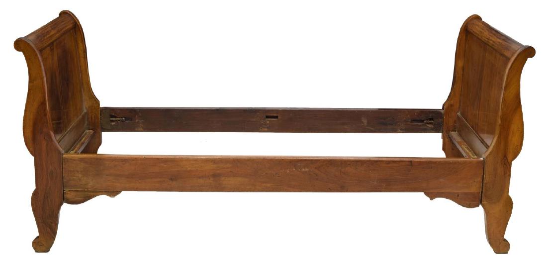 FRENCH EMPIRE STYLE MAHOGANY ALCOVE SLEIGH BED: French Empire style mahogany alcove sleigh bed, 19th c., with outward scrolled head and foot boards, one unfinished rail, exterior: approx 32.5"h, 27.75"w, 75"d, interior: approx 25.75"w, 68.25"d Star