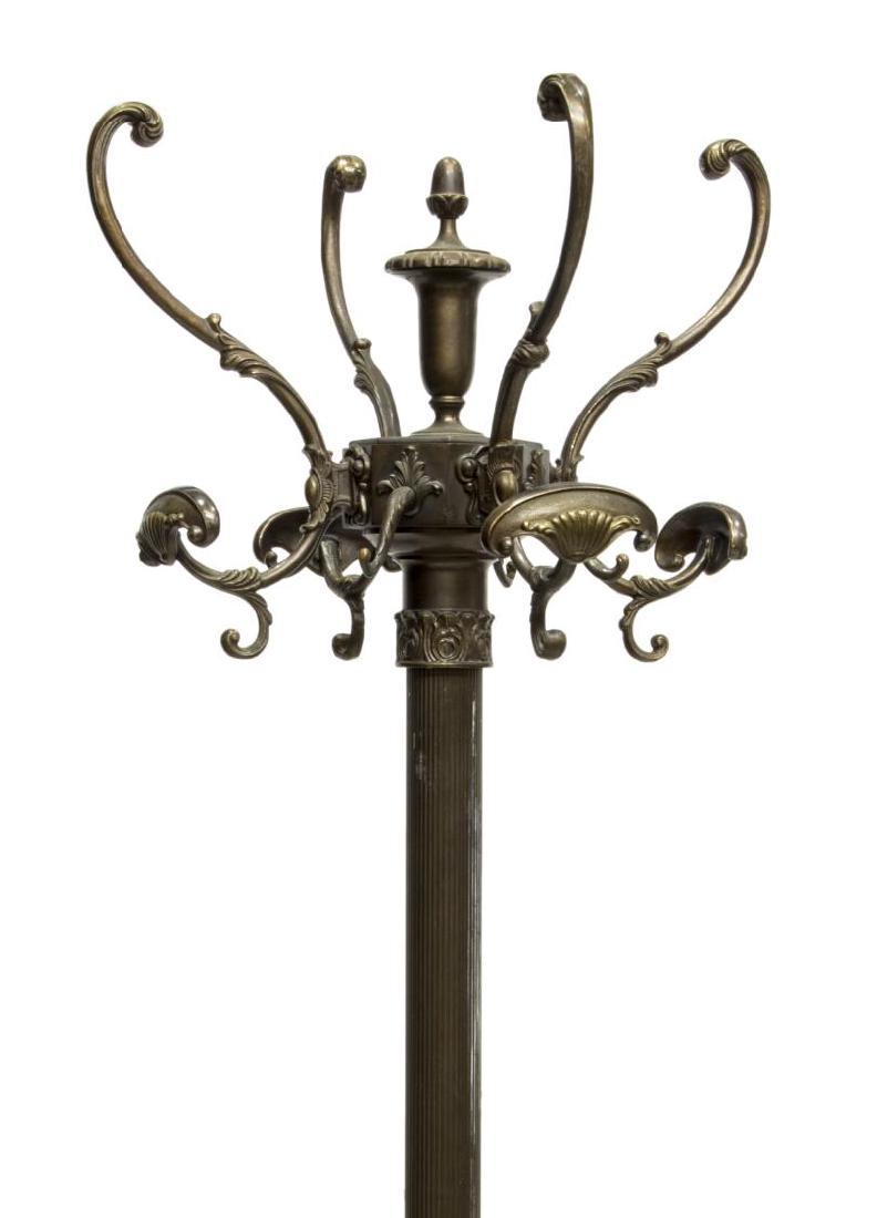ITALIAN HALL TREE WITH HAT & COAT RACKS: Italian patinated bronze hall tree, vasiform and acorn finial, issuing eight arms ending in hat and coat hooks, fluted standard with egg-and-dart and acanthus accents, rising on tripod legs with scrol