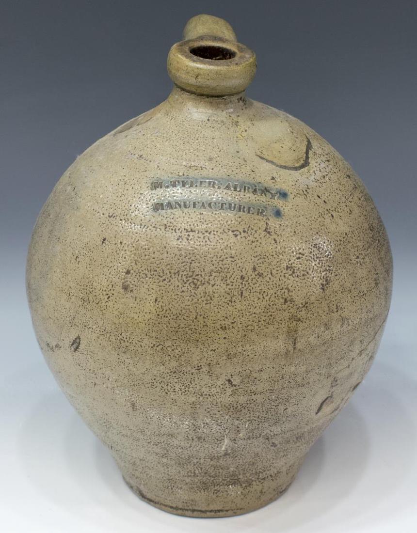 M. TYLER MANUFACTURER SALT GLAZE STONEWARE JUG: Stoneware jug, having salt glaze, New York, c. 1860, narrow lip and neck, globular body, incised to shoulder "M. TYLER. ALBANY, MANUFACTURER" with slight blue tint to letters, approx 11"h, 9"diam, 4lb