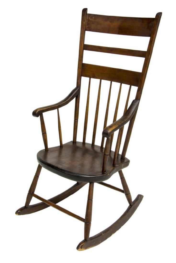 AMERICAN LADDER-BACK ROCKING CHAIR, C. 1860: American ladder-back rocking chair, c. 1860, high back with three horizontal slats over turned spindles, over shield seat, rising on turned legs, joined front and back with stretchers, on curved rocki