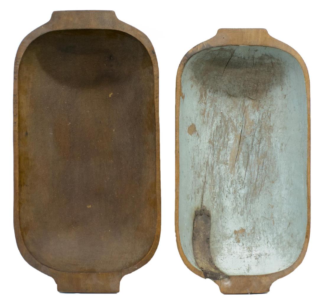 (2) AMERICAN PRIMITIVE TREENWARE, DOUGH BOWLS: (lot of 2) American primitive carved treenware handled dough bowls, 19th/20th c., including one painted turquoise with old metal patch to one end, largest: approx 4"h, 22"w, 11.5"d; 9.25lbs total **Pr