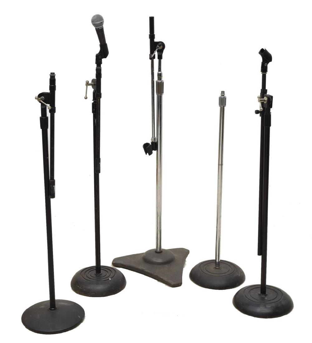 (6) GROUP OF MODERN MICROPHONE STANDS: (lot of 6) Group of microphone stands, including: (5) adjustable microphone stands, (two) with chrome finish, (three) with black finish; (1) Shure handheld microphone, lacking cord; largest stand: 46"