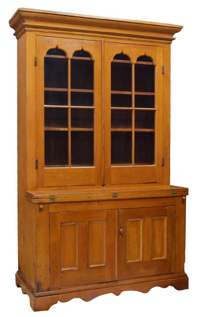 PENNSYLVANIA PINE 19TH C. CUPBOARD: Pennsylvania pine cupboard, 19th c., having a stepped cornice over double glazed doors opening to interior shelves and storage slots, a centered fold out work surface over two paneled doors, vertical 