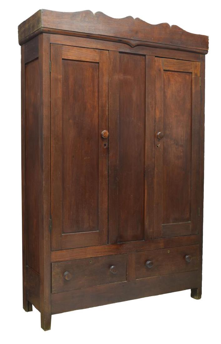 AMERICAN WALNUT WARDROBE, 19TH C.: American walnut wardrobe, 19th c., having a shaped cornice above two paneled doors opening to the divided interior, two lower exterior drawers, four horizontal backboards up to 20"wide joined by squar