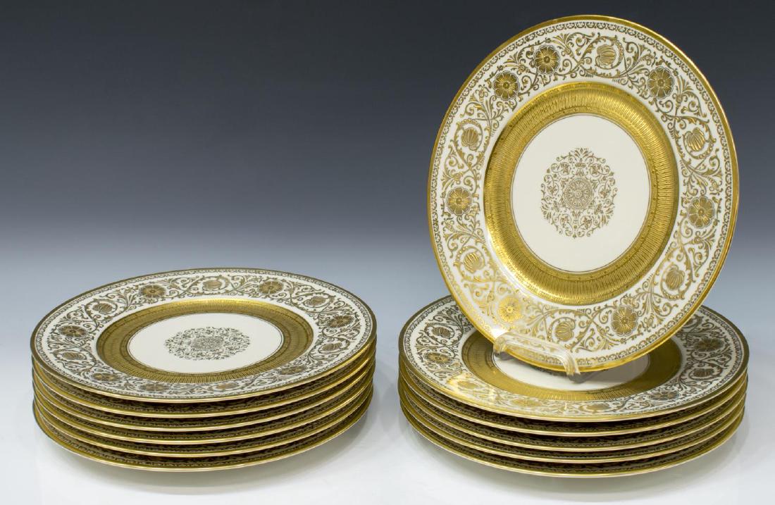 (12) ORNATE CHATEAU GILT PORCELAIN SERVICE PLATES: (lot of 12) Chateau China porcelain service plates, Czechoslovakia, 20th c., center medallion, surrounded by embossed gilt band, outside rim with raised rocaille floral motif, approx 10.75"diam, 18lbs