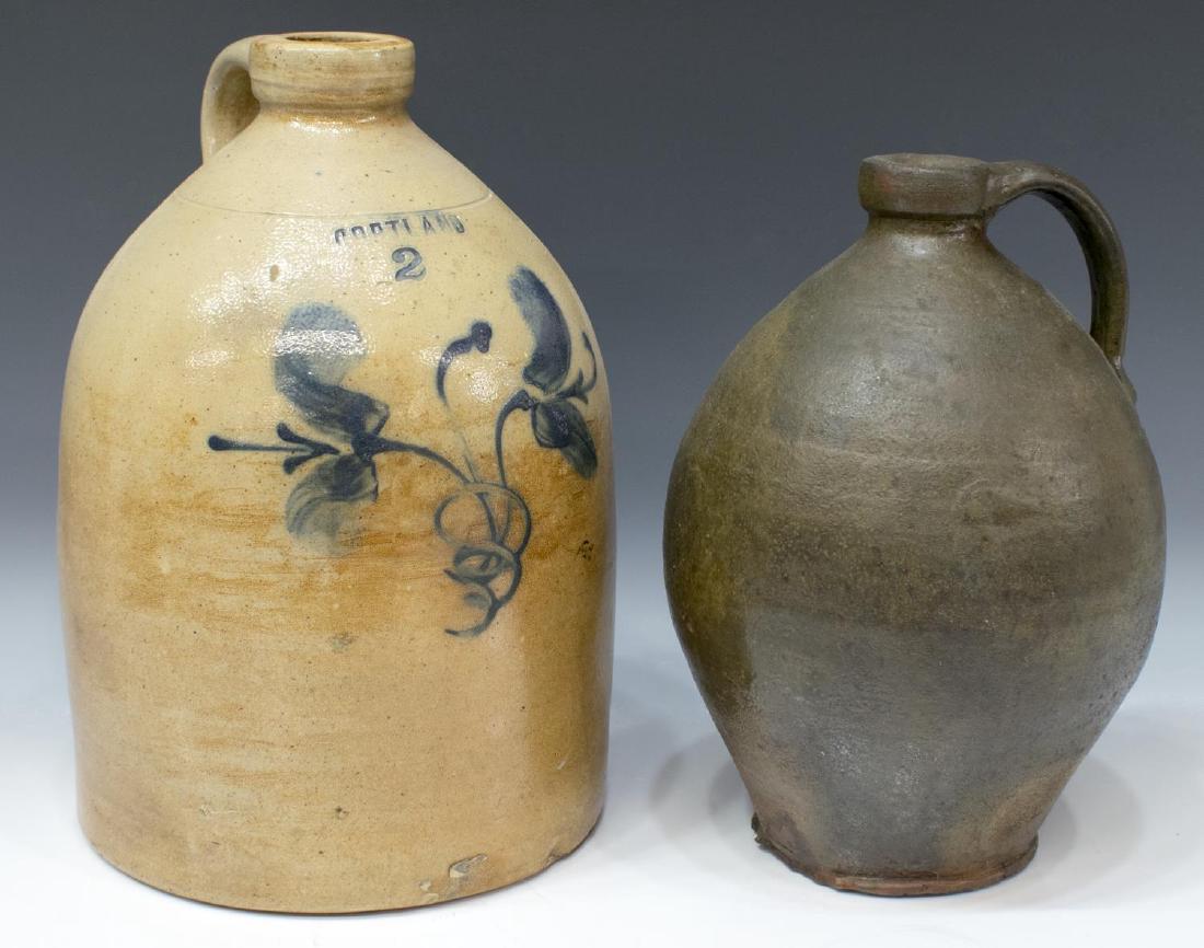 (2) ANTIQUE AMERICAN PRIMITIVE STONEWARE JUGS: (lot of 2) American stoneware jugs, including: (1) 2-gallon jug, c. 1860, incised "Portland" to shoulder, with floral blue design to front, approx 13.25"h, 9"diam; (1) brown stoneware jug, tapered bod