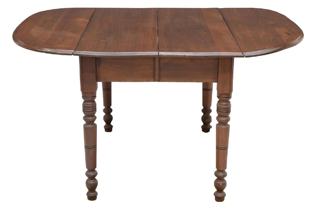 AMERICAN MAHOGANY DUAL DROP LEAF TABLE, C. 1885: American mahogany drop leaf and expanding table, now braced, 19thc., having oval top, rising on bead-and-ring-and-block turned tapered legs, blunt arrow feet, stenciled on sliders underneath "CLIMAX T