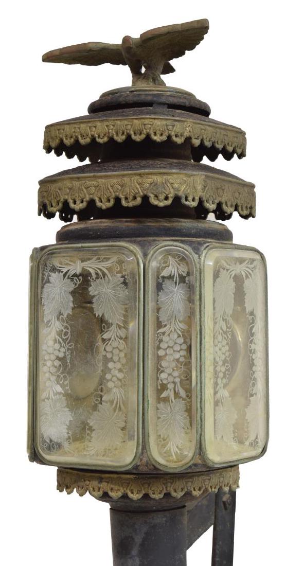 LARGE FEDERAL STYLE EAGLE FINIAL COACH LANTERN: Federal style mixed metal coach lantern, electrified, an eagle surmounting two tiers, grape clusters and leafy vines etched on beveled glass panes, reflectors and single socket to the interior, the lo