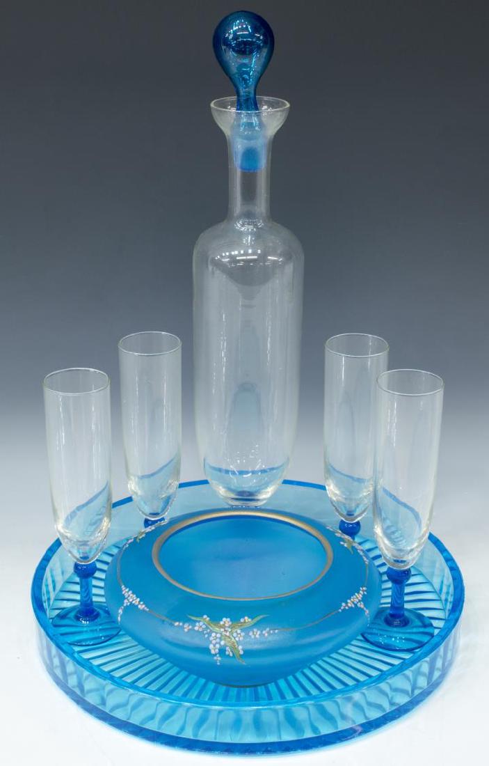 (7) BLUE GLASS LIQUEUR SET DECANTER, STEMS, & TRAY: (lot of 7) Decorative glass table and cabinet items, including: (6 piece) Liqueur set, mid 20th c., decanter with colorless glass body, raised on blue circular foot, accompanied by four corresponding 