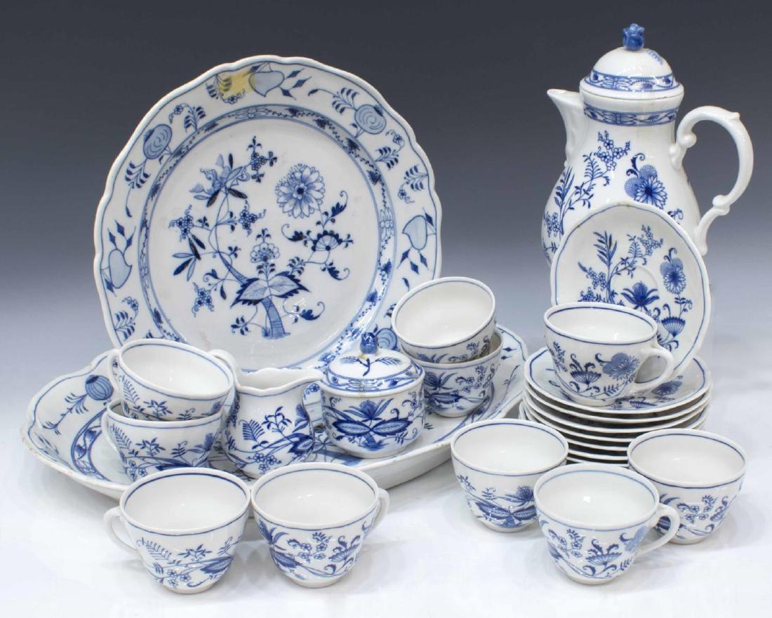 (23) BLUE ONION TYPE PORCELAIN SERVICE & TABLEWARE: (lot of 23) Collection of 'Blue Onion' type porcelain serviceware, including: (1) oval service tray and (1) circular tray, both marked Meissen in an oval, largest: 18"l, 12.75"w; (23pc) Bavarian tea s