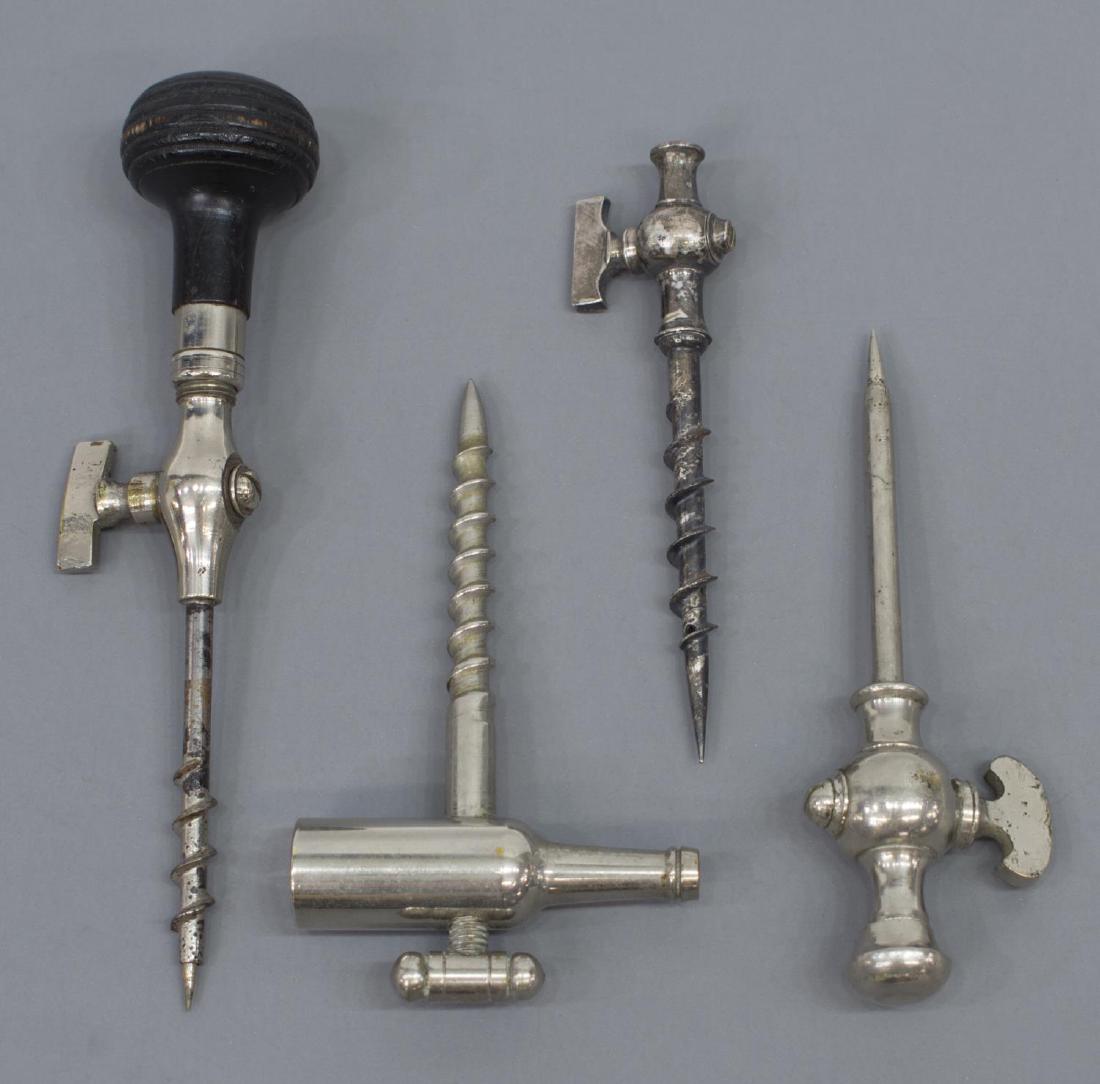(4) SILVER TONE CHAMPAGNE TAPS, REMOVABLE TROCARS: (lot of 4) Silver tone metal champagne taps, 19th/20th c., including: (3) having removable trocar, (one) with ebonized wood handle, (one) lacking trocar; (1) with screw spigot, shaped like champagne b
