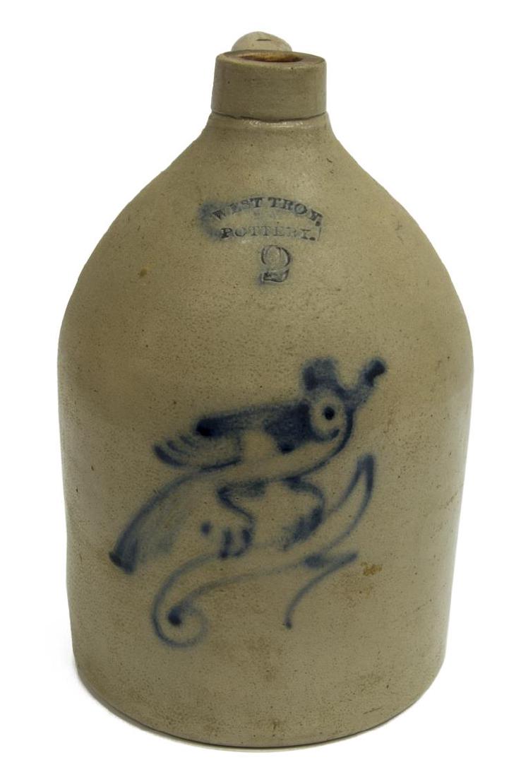 WEST TROY POTTERY NEW YORK 2-GAL STONEWARE JUG: Two gallon salt-glazed stoneware jug, New York, c. 1860, stamped West Troy, Pottery, cobalt slip design of a bird on a branch at front face, with pulled handle, approx 14"h, 8.5"diam, 9lbs **Provenanc