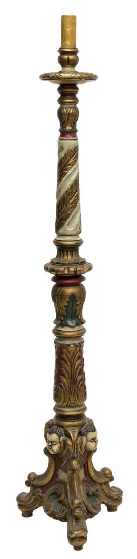 SPANISH PARCEL GILT CARVED WOOD CHURCH LIGHT: Spanish carved wood altar light, now electrified, faux candle fixture to top, over carved and turned standard with masks, parcel gilt and polychrome paint, rising on scroll tripartite base, in need of