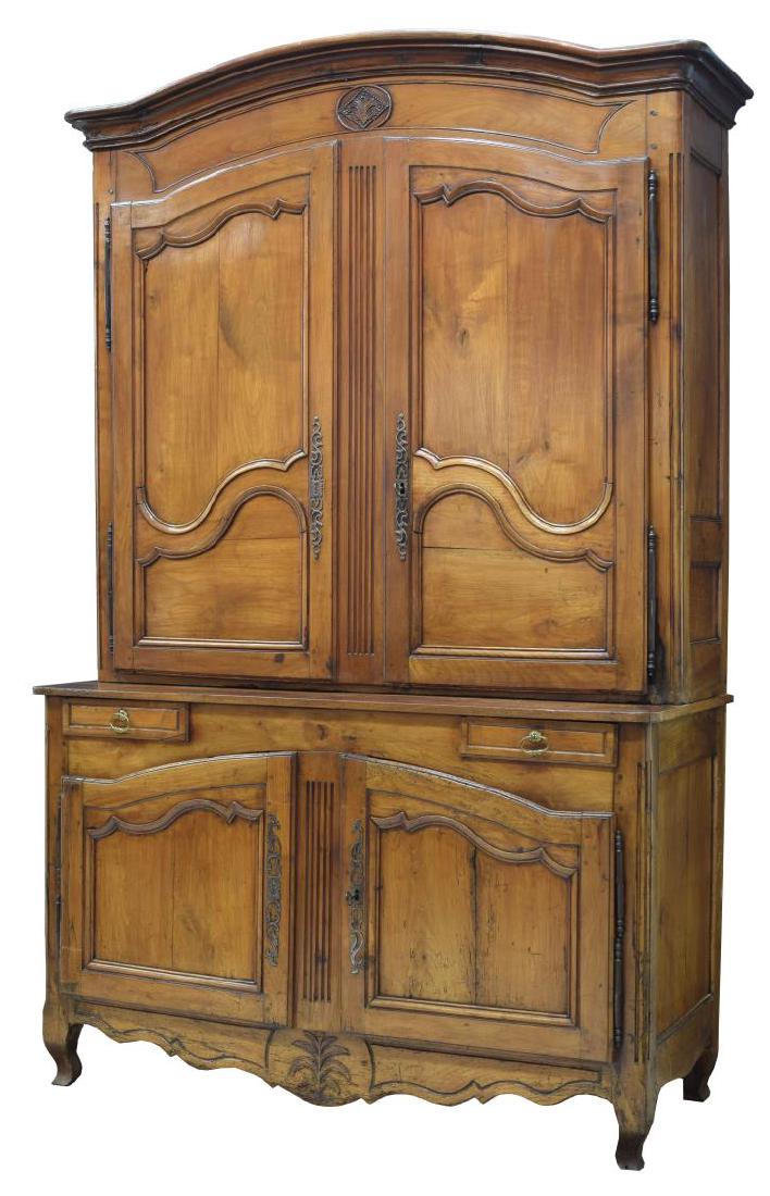 FRENCH LOUIX XVI DEUX CORPS CABINET, 18TH C.: French Louis XVI period fruitwood deux corps cabinet, 18th c., the upper part with an arched cornice, a foliate carved cartouche centered at the frieze, two doors opening to shelves, the lower part wi