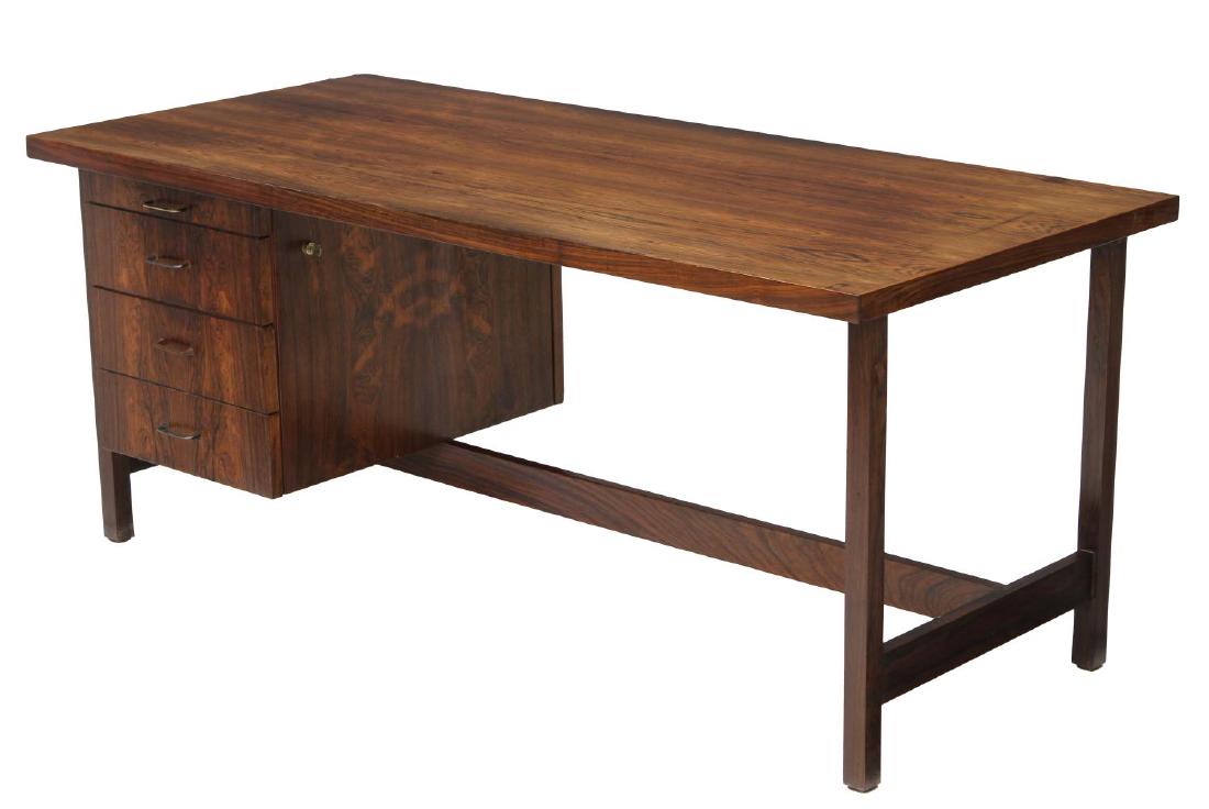 ITALIAN MID-CENTURY MODERN ROSEWOOD WRITING DESK: talian design mid-century modern rosewood writing desk, c. 1960, finely figured wood, lockable top drawer retaining keys and opening to sectioned plastic tray, four drawers total, rise on stretcher jo